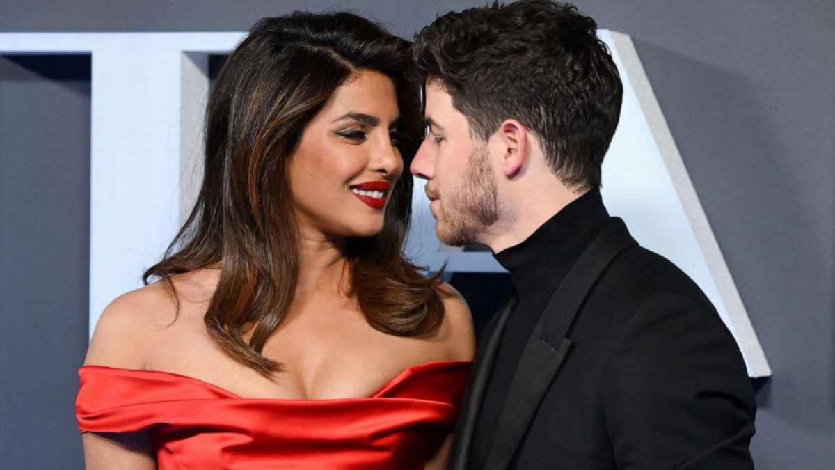 nick-jonas-fixing-priyanka-chopra-ponytail-becomes-internet-sweetest-moment-hollywood-strike-heads-of-state